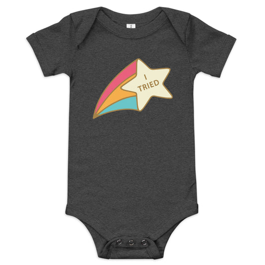 A Dark Grey Heather baby short sleeve one-piece with a colorful star and the text 'I TRIED' printed on the front.