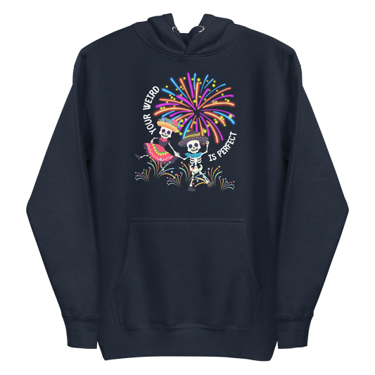 A navy blazer premium hoodie featuring a colorful graphic of two skeletons dancing in festive attire under fireworks. Curved text reads 'YOUR WEIRD IS PERFECT'.