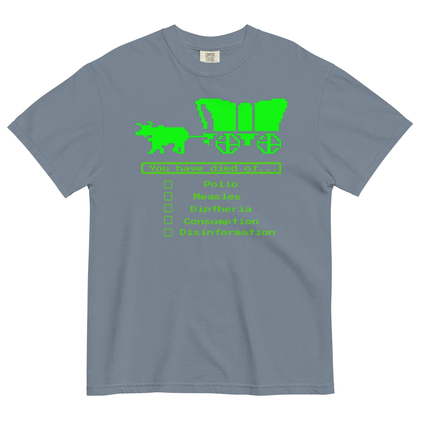 A blue jean colored short-sleeve crewneck t-shirt featuring a bright green, retro 8-bit pixel graphic. The design shows an ox pulling a covered wagon above a text box that reads 'You have died of...'. Below the text is a checklist with empty square boxes next to the words 'Polio', 'Measles', 'Diptheria', 'Consumption', and 'Disinformation'