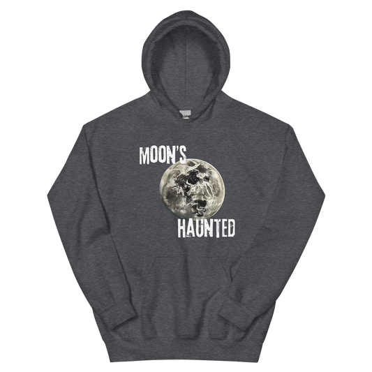 A dark heather hoodie featuring the text 'MOON'S HAUNTED' in a distressed font, surrounding a moon graphic with a subtle skull face hidden in the craters.