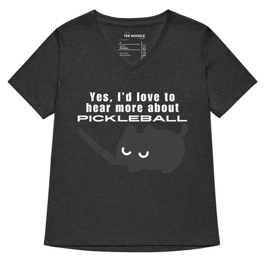 A women's dark grey heather relaxed v-neck t-shirt featuring a graphic of an angry black cat holding a knife below the sarcastic text: 'Yes, I'd love to hear more about PICKLEBALL'.