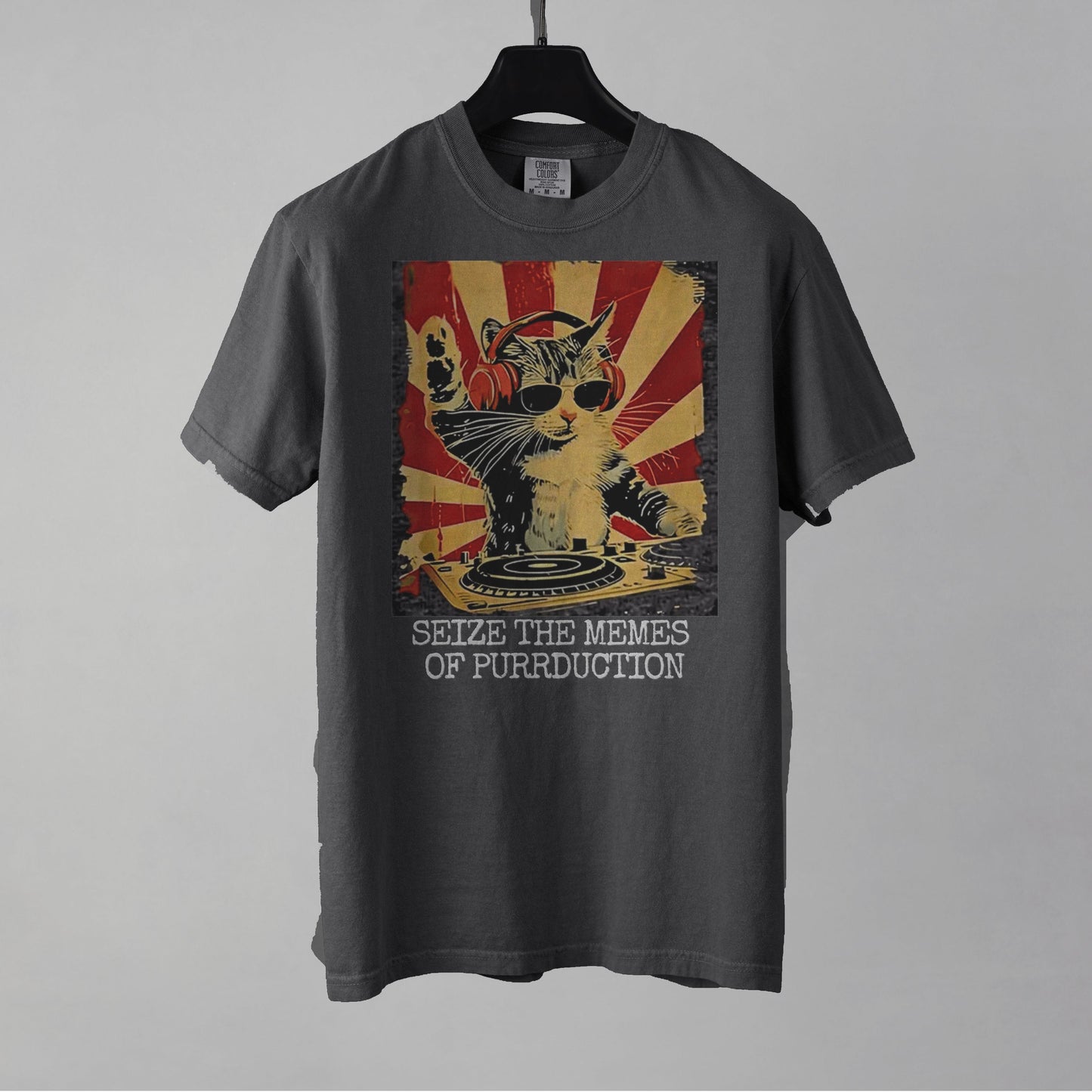 Gray t-shirt with a cat graphic and text on a gray background