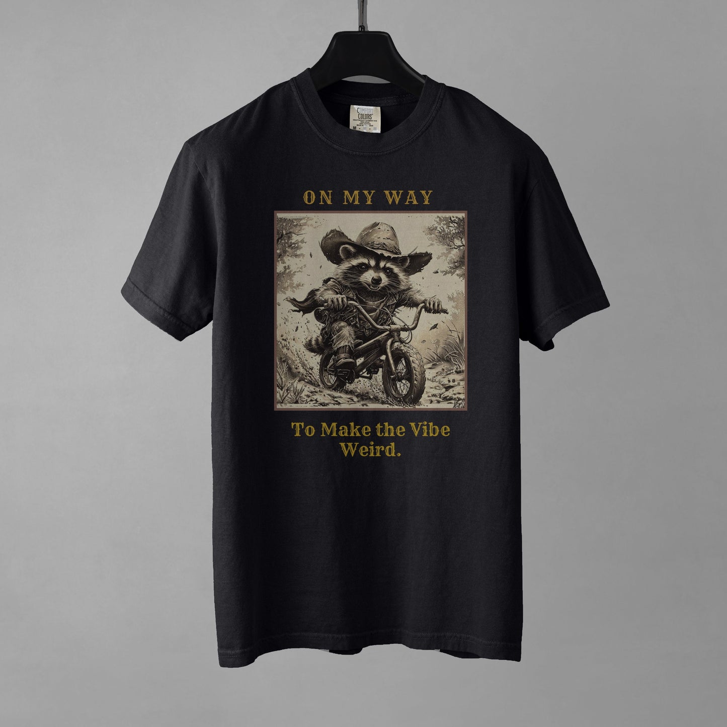 Black t-shirt with graphic design and text on a gray background