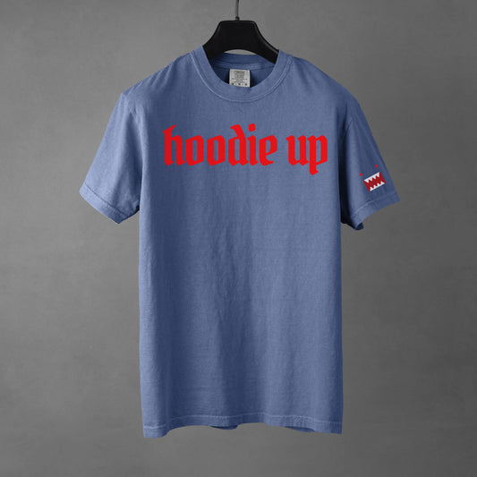 Blue t-shirt with red text 'hoodie up' on a gray background