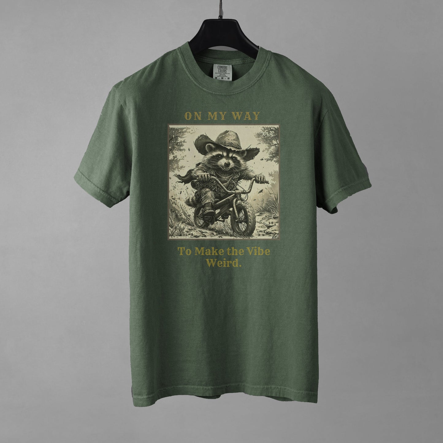 Green t-shirt with graphic design and text on a gray background