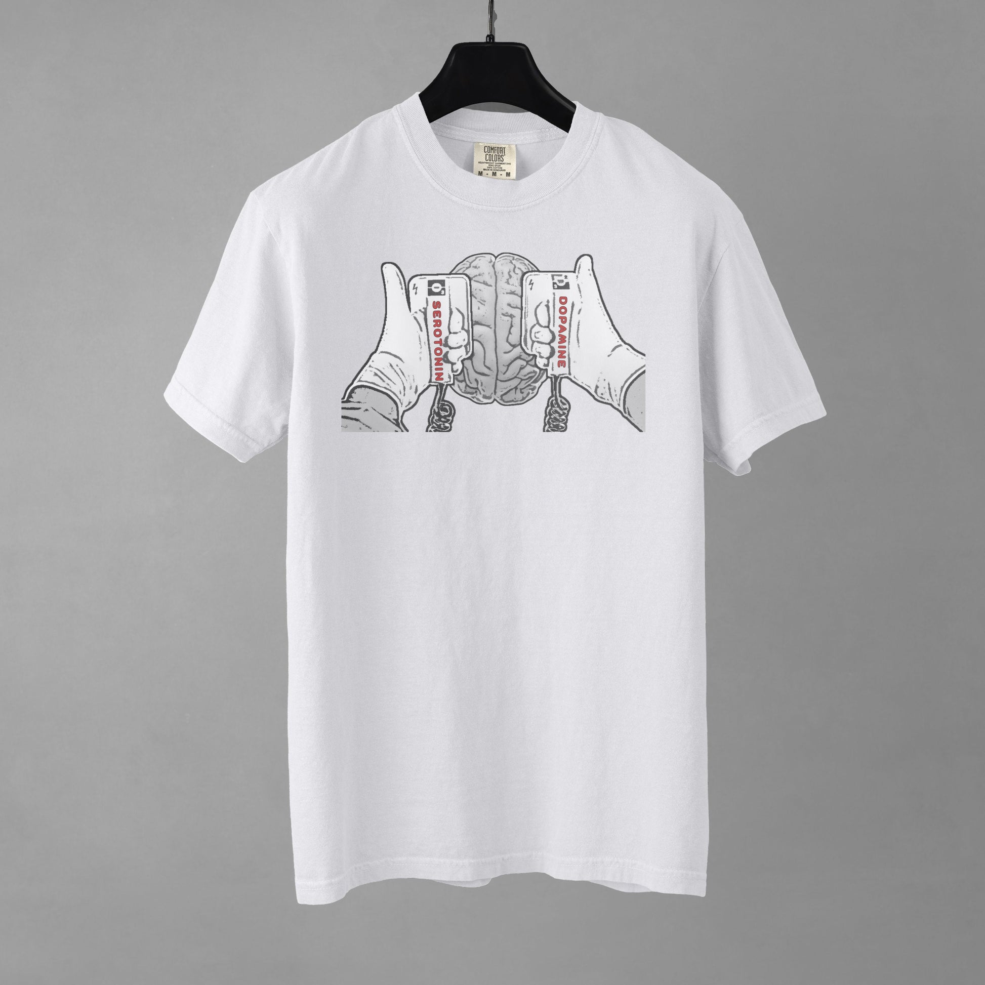 White t-shirt with graphic design on a gray background