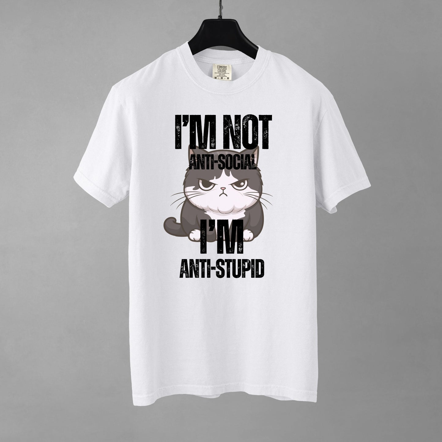 White t-shirt with a graphic of a cat and text on a gray background