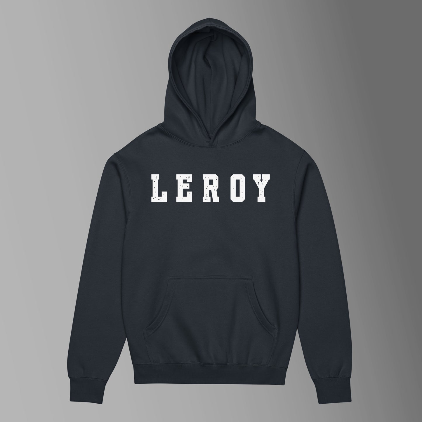 A navy blue pullover hoodie featuring the name 'LEROY' printed horizontally across the chest in large, distressed white collegiate block letters. The hoodie includes a front kangaroo pocket and a ribbed waist and cuffs.