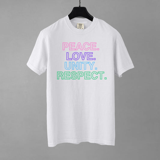 A white t-shirt with colorful text stacked in descending order that reads 'PEACE. LOVE. UNITY. RESPECT.' on a gray background.