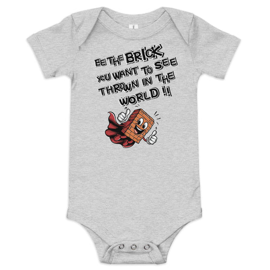 An Athletic Heather short sleeve baby one piece showing a brick wearing a cape, smiling and giving a thumbs up gesture, on the front with text the reads: "BE THE BRICK YOU WANT TO SEE THROWN IN THE WORLD!!"