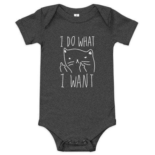 A dark grey heather short sleeve baby one piece showing a cartoon line drawing of a cat holding its forepaws up, giving a middle finger gesture, on the front with text the reads: "I DO WHAT I WANT"
