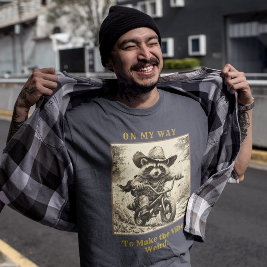 Man wearing a t-shirt with a graphic design and text, holding a checkered shirt.