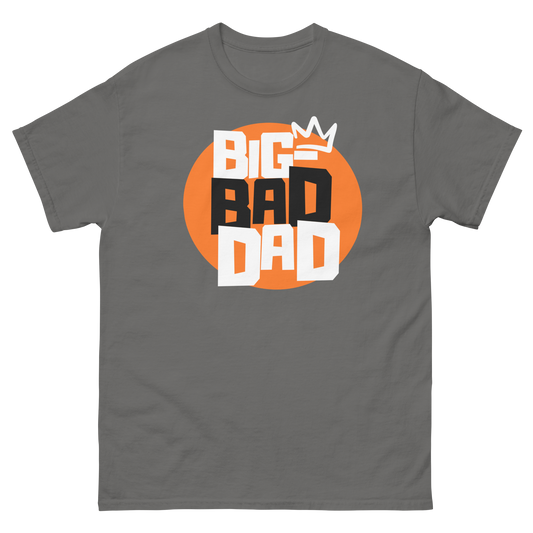 A charcoal t-shirt featuring a large orange circle graphic with the text 'BIG BAD DAD' in stacked block letters, topped with a white crown.