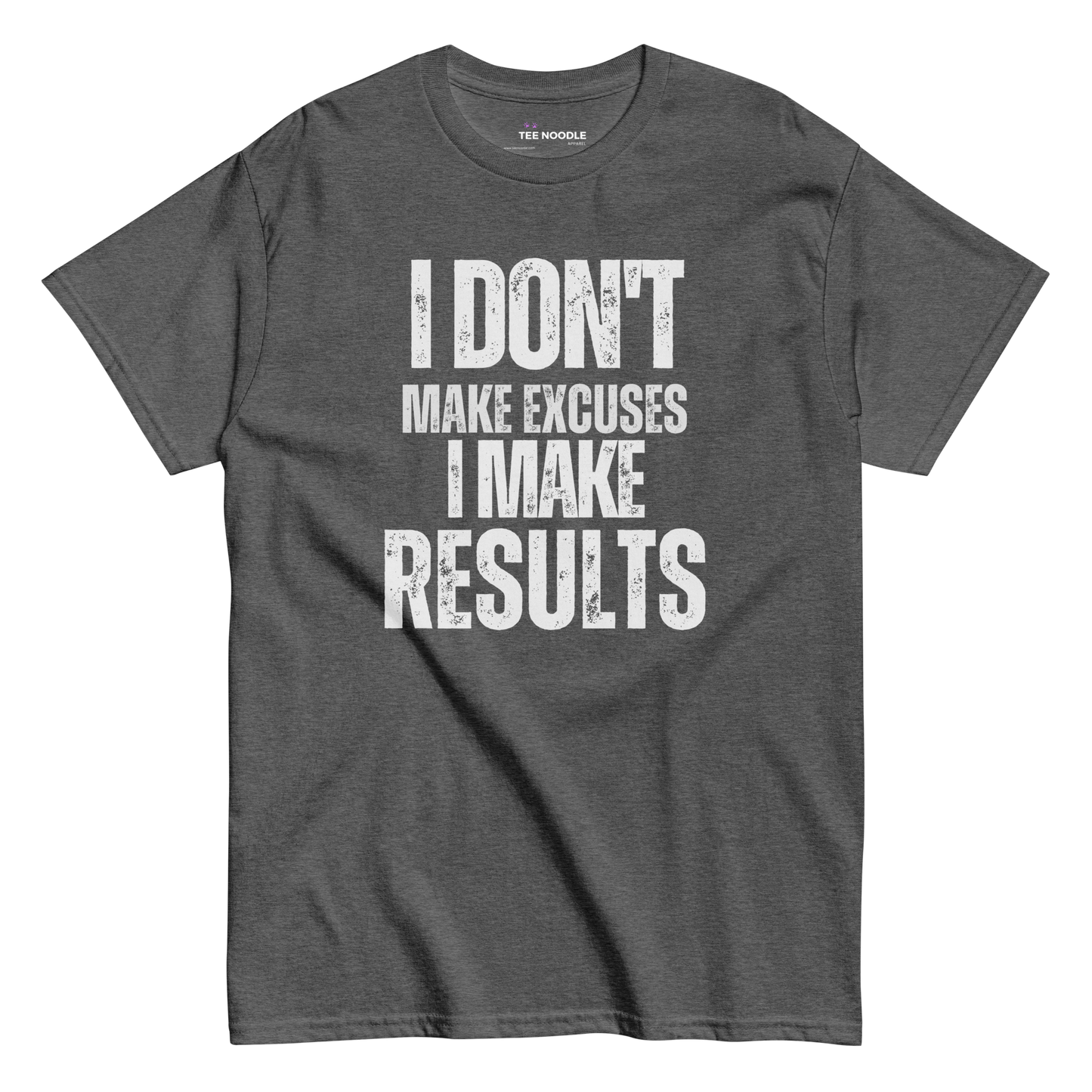 A dark heather t-shirt featuring the motivational slogan 'I Don't Make Excuses, I Make Results' in bold, distressed white typography.
