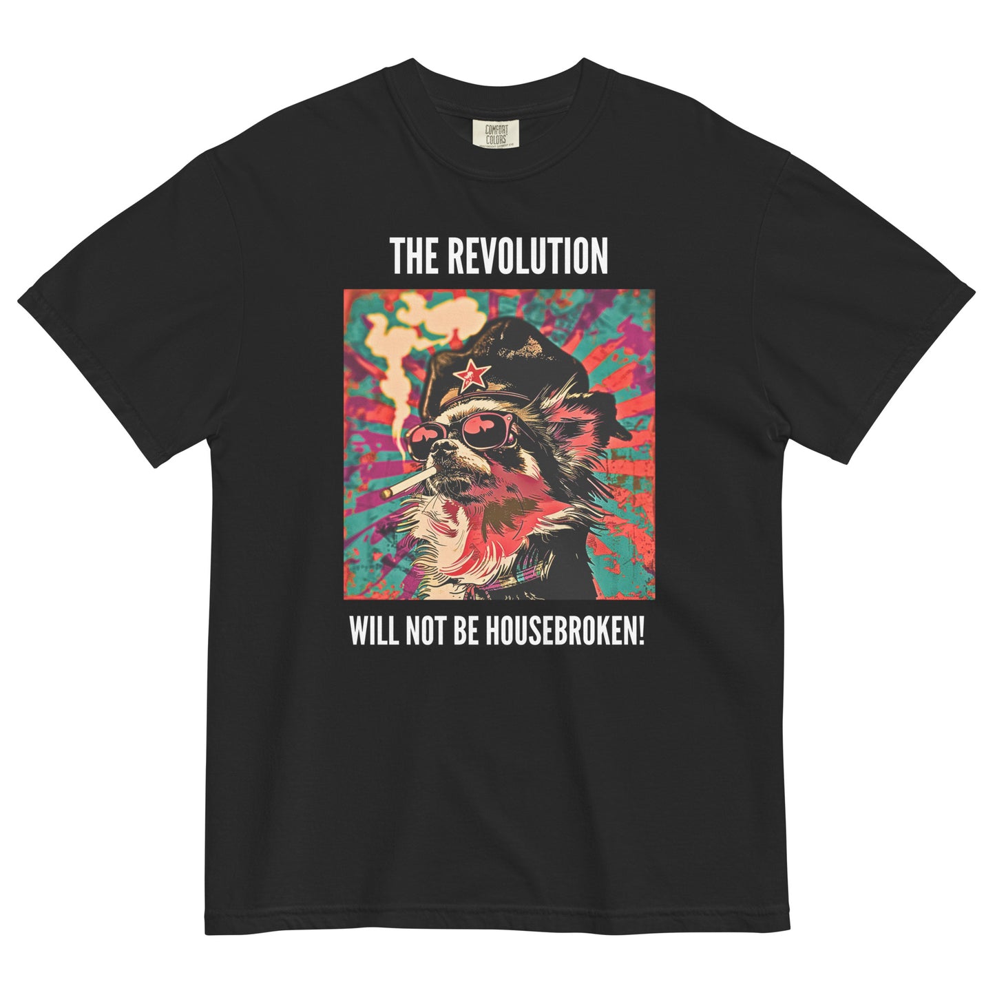 A black colored short-sleeve crewneck t-shirt featuring a vibrant, pop-art style square graphic on the chest. The illustration shows a long-haired Chihuahua stylized as a revolutionary, wearing a black hat with a red star, red-tinted sunglasses, and smoking a cigarette, set against a colorful, grunge-textured teal and red sunburst background. Above the graphic in white capital letters is the text 'THE REVOLUTION', and below it reads 'WILL NOT BE HOUSEBROKEN!'.