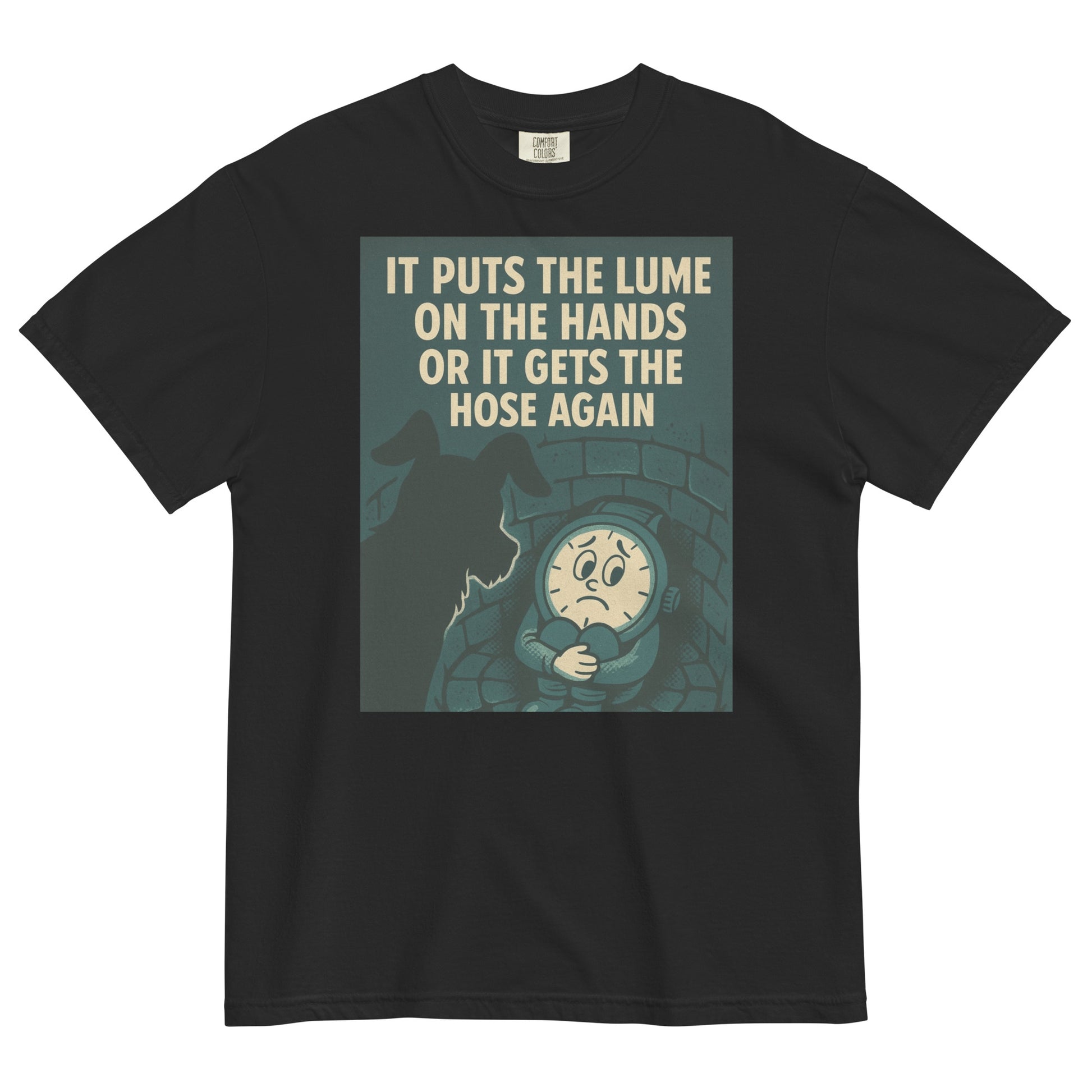 A black colored t-shirt with a chest graphic in dark grayish green with a cream colored line drawing of an anamorphic watch face sitting at the bottom of a brick lined well with its knees drawn up to its chest, held by its arms. Looking down into the well is the silhouette of a small dog. The top of the graphic shows the text, in all caps, 'IT PUTS THE LUME ON THE HANDS OR IT GETS THE HOSE AGAIN'.
