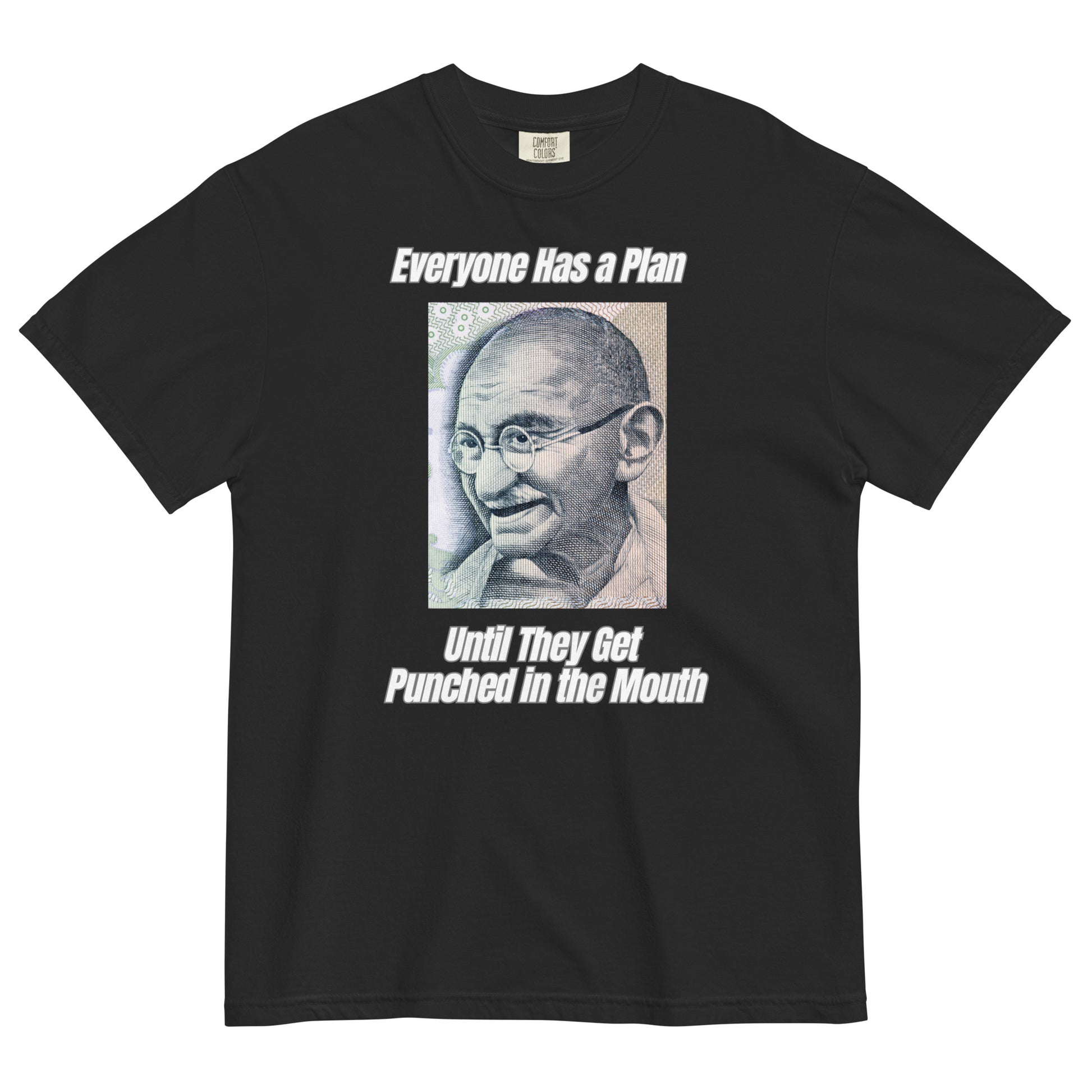 A black colored t-shirt featuring a vintage portrait of Mahatma Gandhi ironically paired with the famous quote 'Everyone Has a Plan Until They Get Punched in the Mouth'