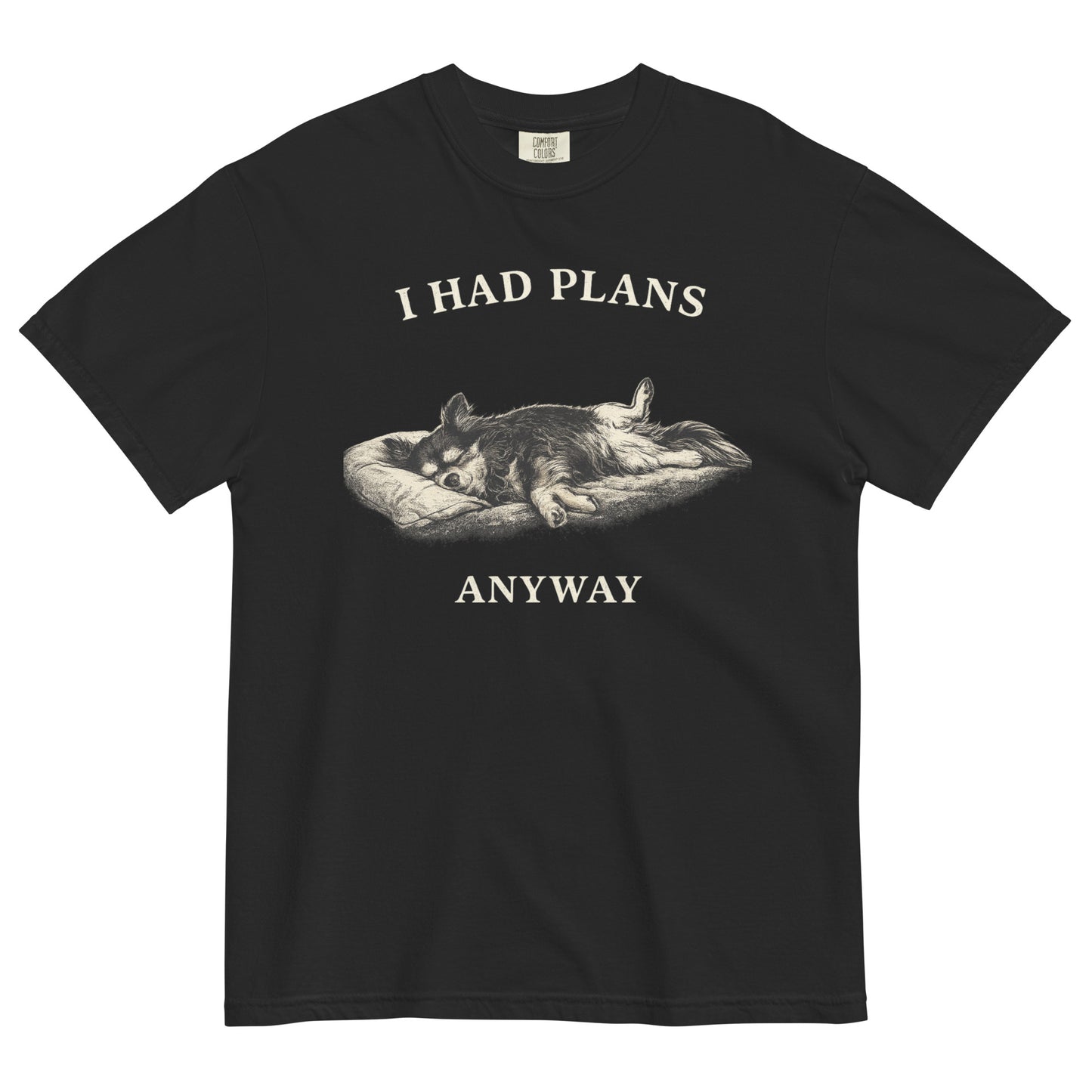 A black colored t-shirt featuring a monochrome illustration of a long-haired Chihuahua sleeping deeply on its back in a dog bed, with rear legs splayed open and forepaws crossed. Above the illustration in bold, white capital letters is the text 'I HAD PLANS', and below it reads 'ANYWAY'.