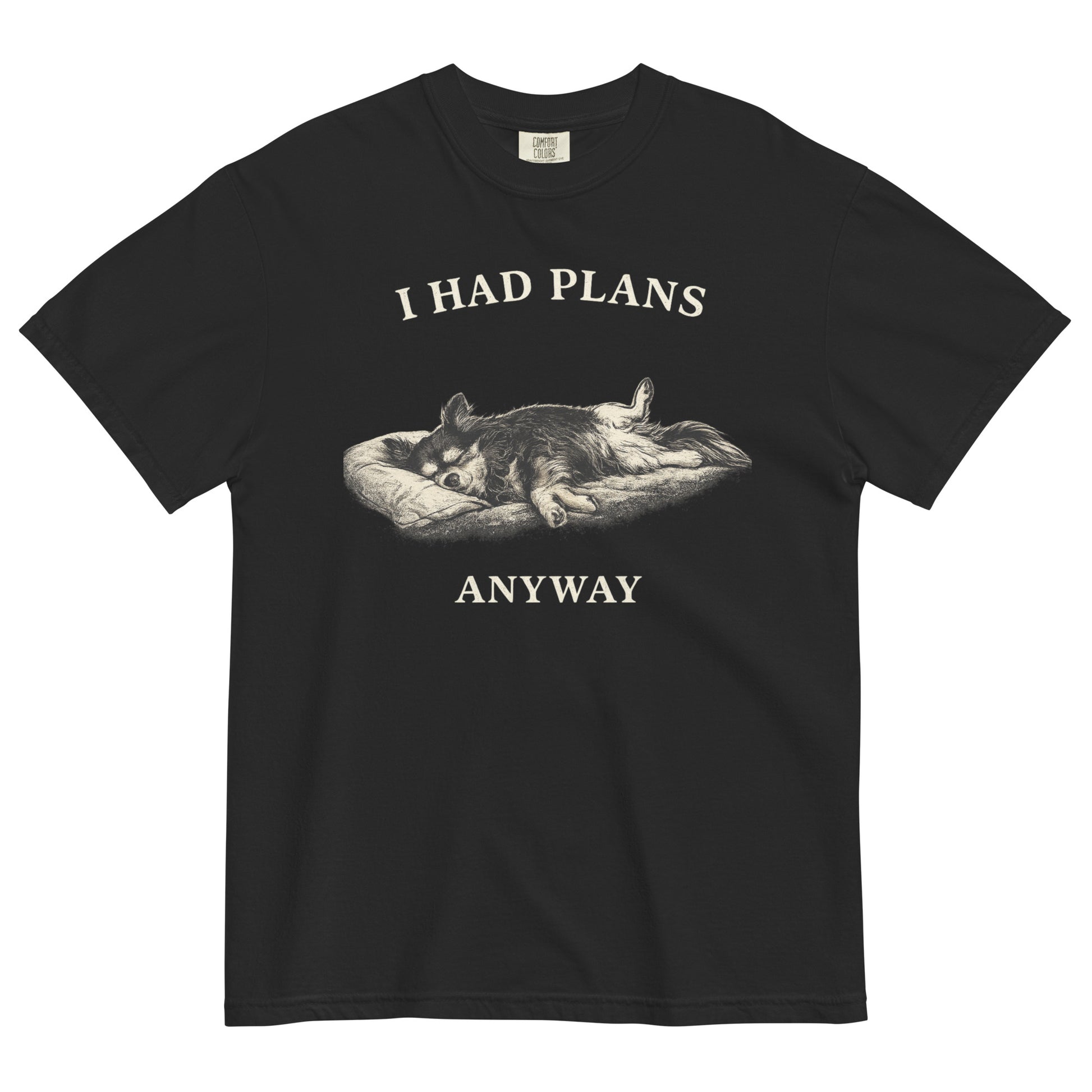 A black colored t-shirt featuring a monochrome illustration of a long-haired Chihuahua sleeping deeply on its back in a dog bed, with rear legs splayed open and forepaws crossed. Above the illustration in bold, white capital letters is the text 'I HAD PLANS', and below it reads 'ANYWAY'.