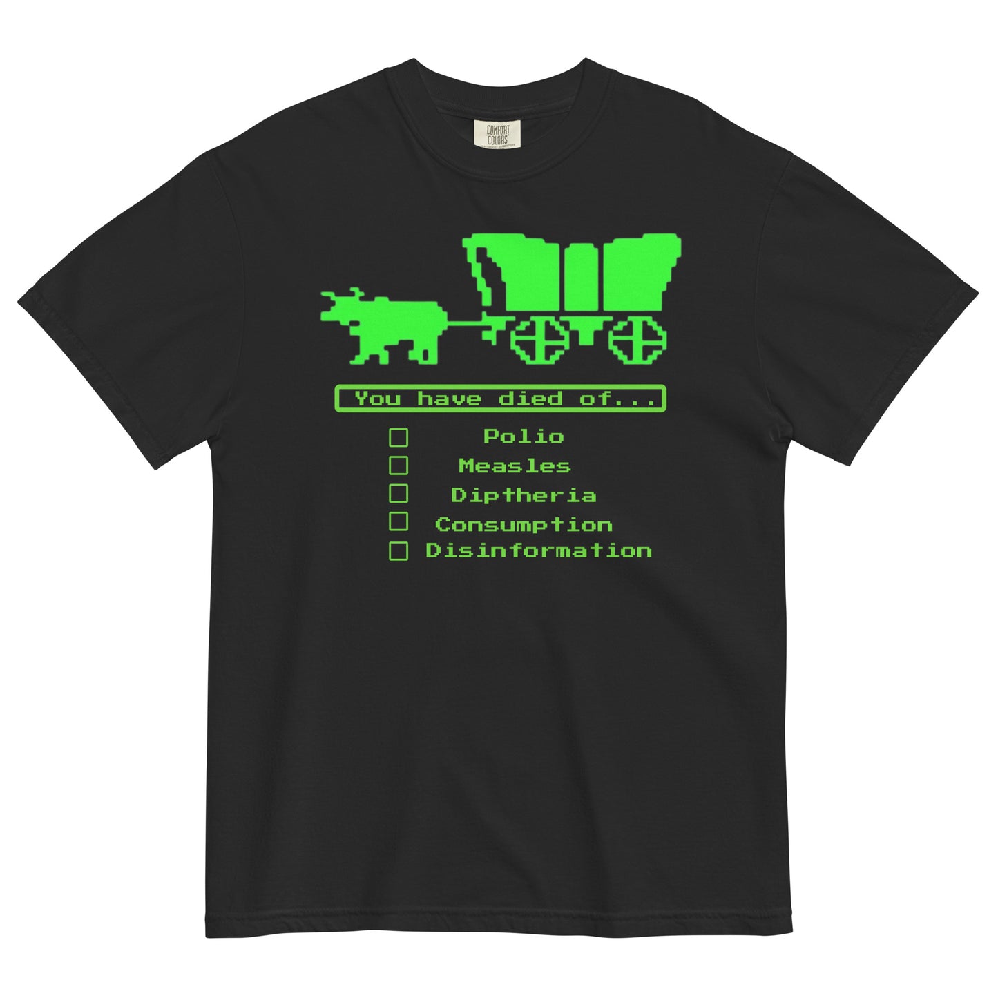 A black short-sleeve crewneck t-shirt featuring a bright green, retro 8-bit pixel graphic. The design shows an ox pulling a covered wagon above a text box that reads 'You have died of...'. Below the text is a checklist with empty square boxes next to the words 'Polio', 'Measles', 'Diptheria', 'Consumption', and 'Disinformation'