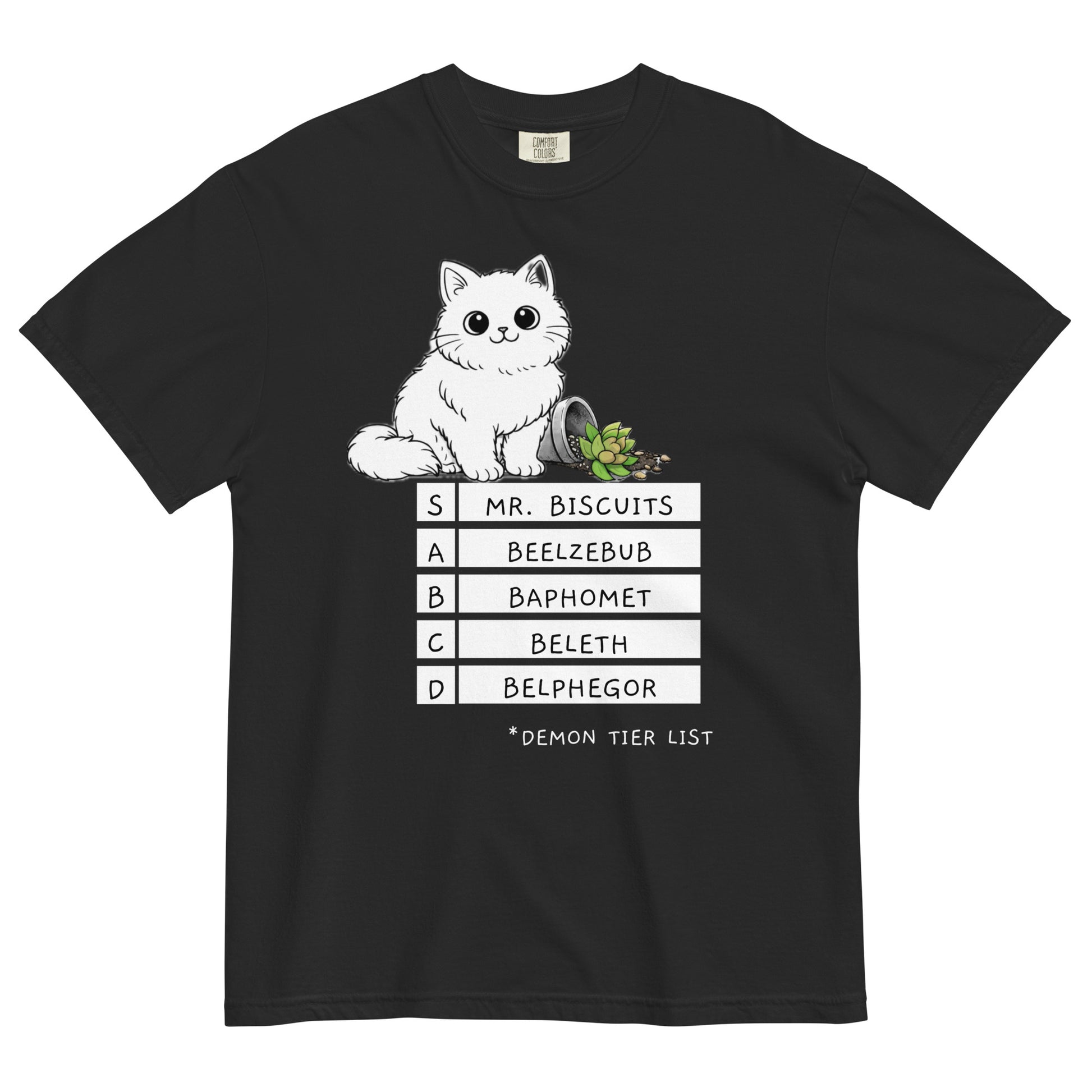 A black colored t-shirt with a graphic of a white, fluffy kitten standing behind a knocked over plant. Beneath the cat is a 'Demon Tier List' with the cat 'Mr. Biscuits' listed atop the list in the S tier position.