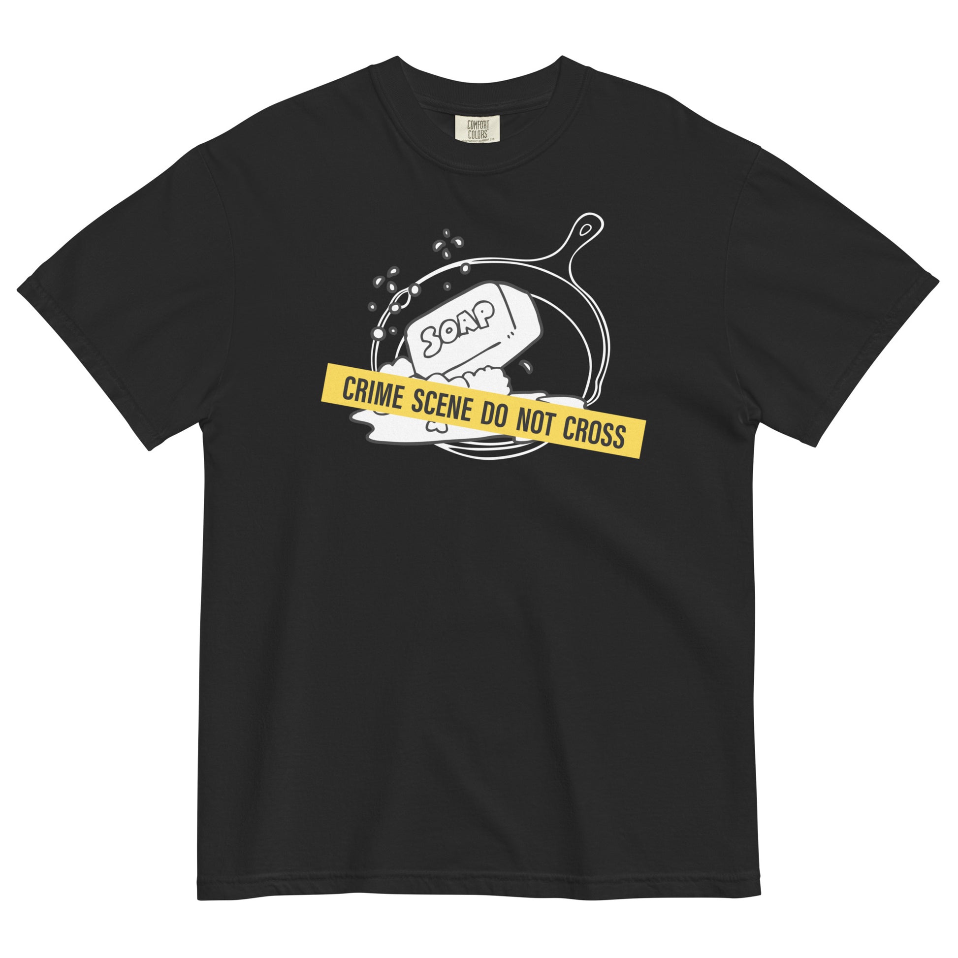 A black t-shirt with a graphic of a cast iron pan with a bar of soap in it, crossed with crime scene tape that reads 'Crime Scene Do Not Cross'.
