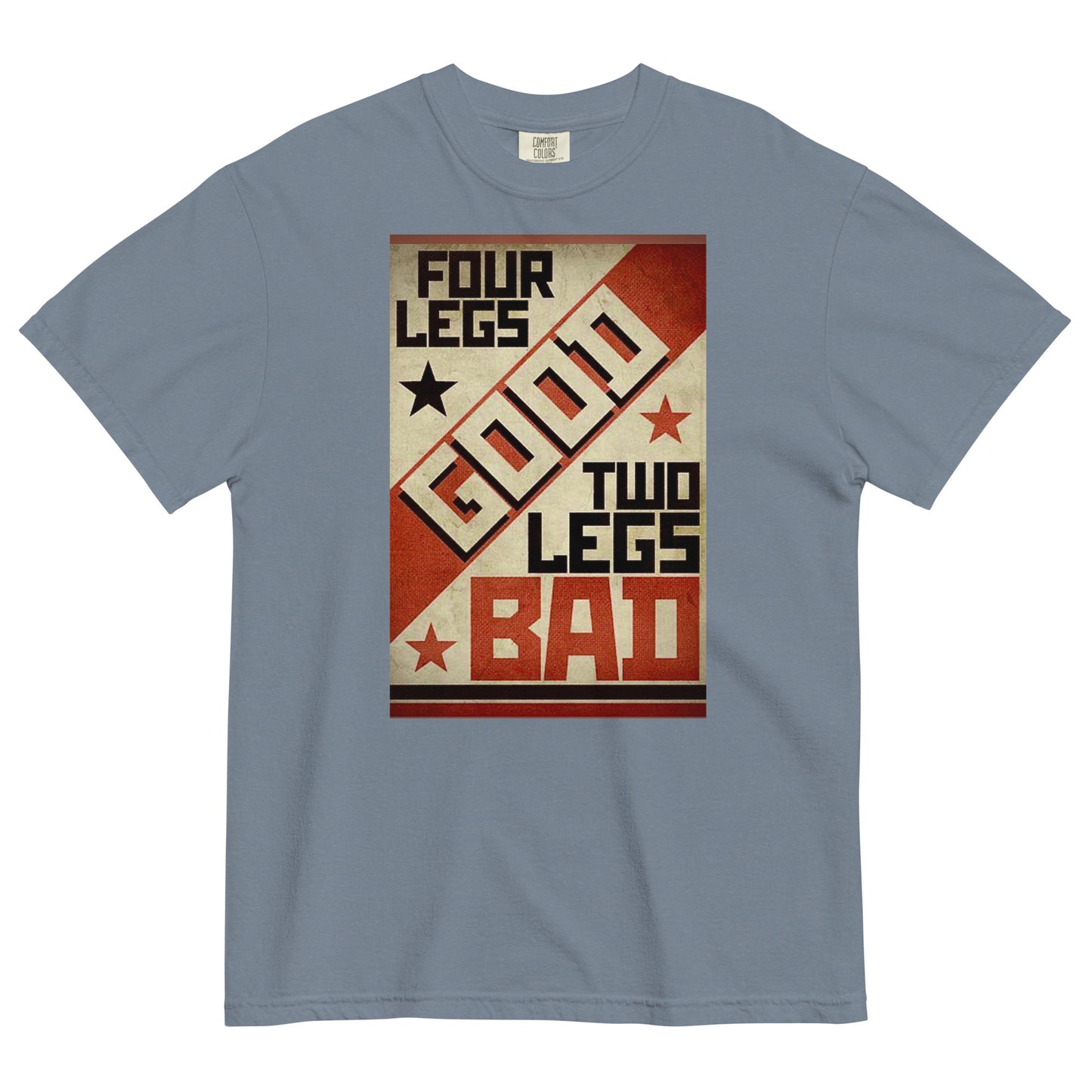 A blue jean colored short-sleeve crewneck t-shirt featuring a retro propaganda-style rectangular graphic. The design uses a textured tan, red, and black color palette with diagonal geometric blocking. It features the text 'FOUR LEGS' in black, a large diagonal 'GOOD' in off-white, 'TWO LEGS' in black, and a large 'BAD' in red at the bottom. The design is accented with small black and red stars.