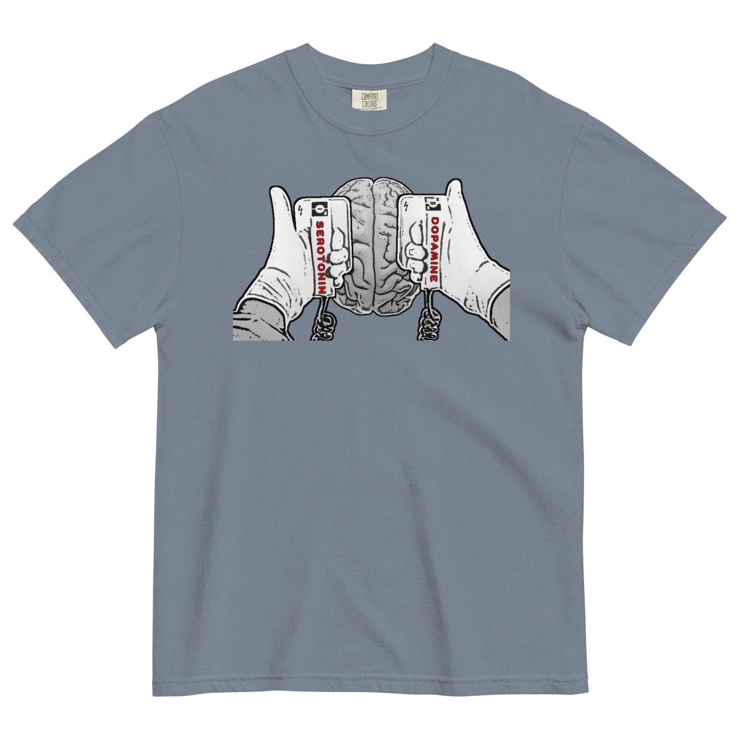 A blue jean colored t-shirt with a black and white line drawing graphic on the chest that shows a brain beneath two hands holding defibrillator paddles. The left paddle is labelled Serotonin and the right paddle is labelled Dopamine.  