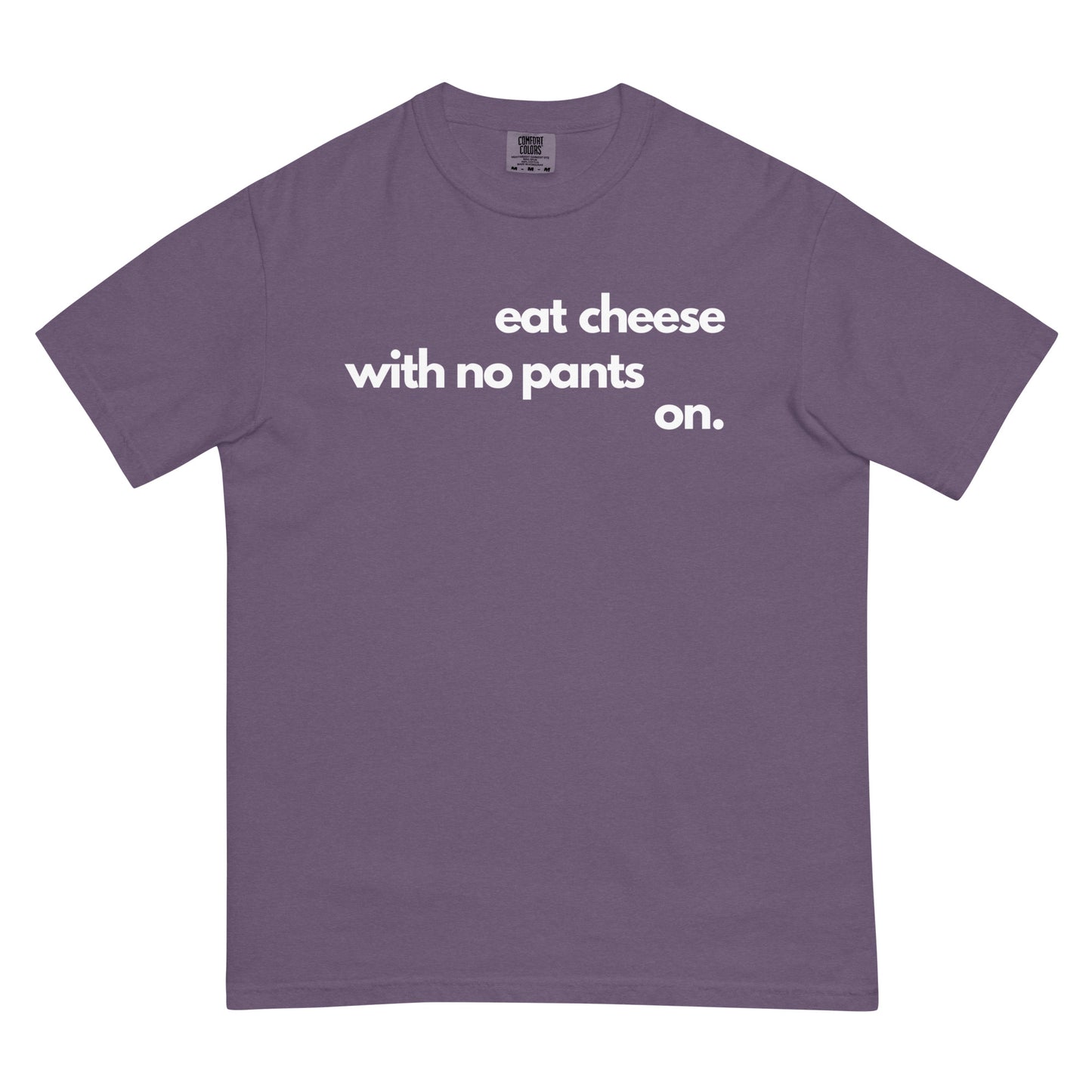 A grape colored t-shirt with text that reads 'eat cheese with no pants on' on a white background.
