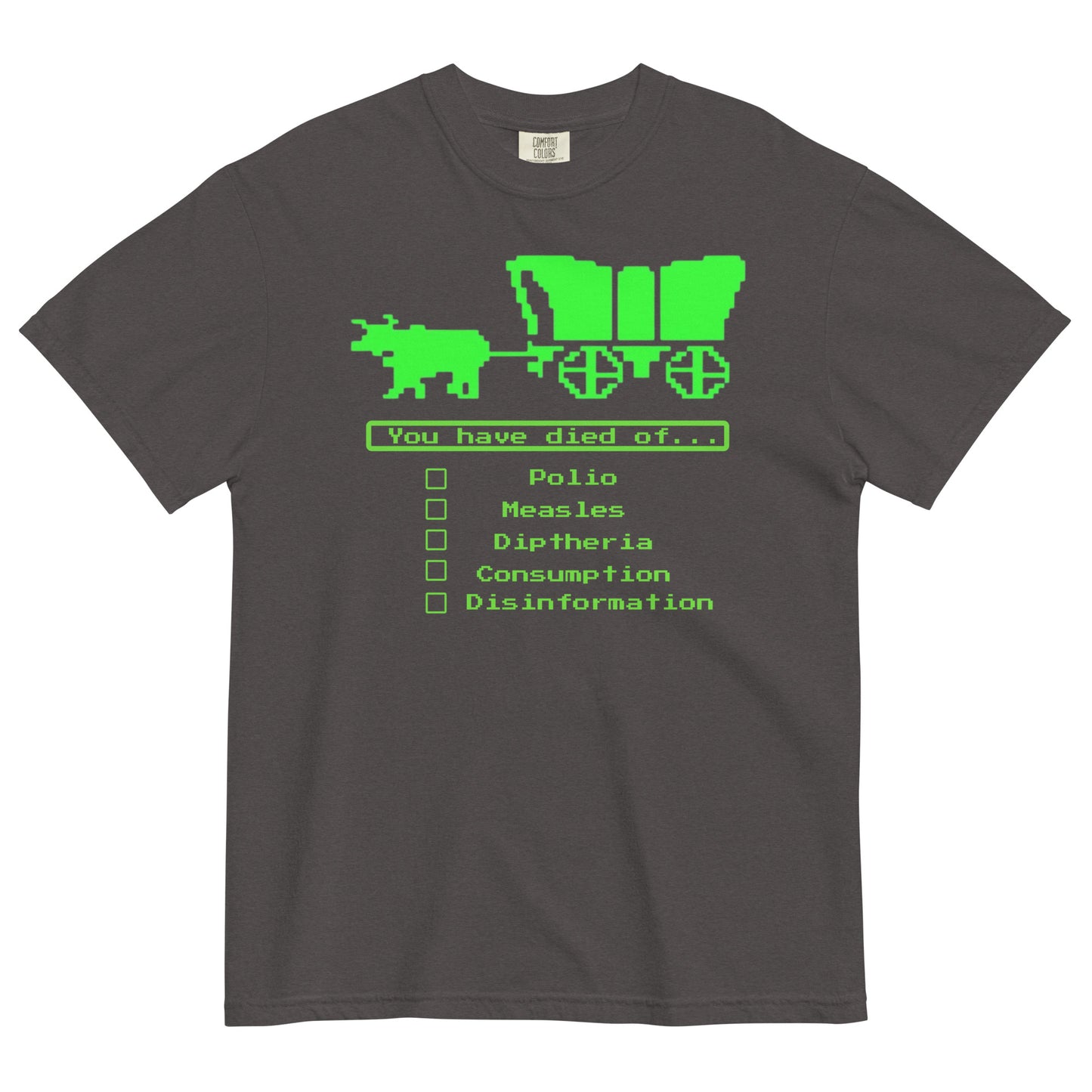 A graphite colored short-sleeve crewneck t-shirt featuring a bright green, retro 8-bit pixel graphic. The design shows an ox pulling a covered wagon above a text box that reads 'You have died of...'. Below the text is a checklist with empty square boxes next to the words 'Polio', 'Measles', 'Diptheria', 'Consumption', and 'Disinformation'