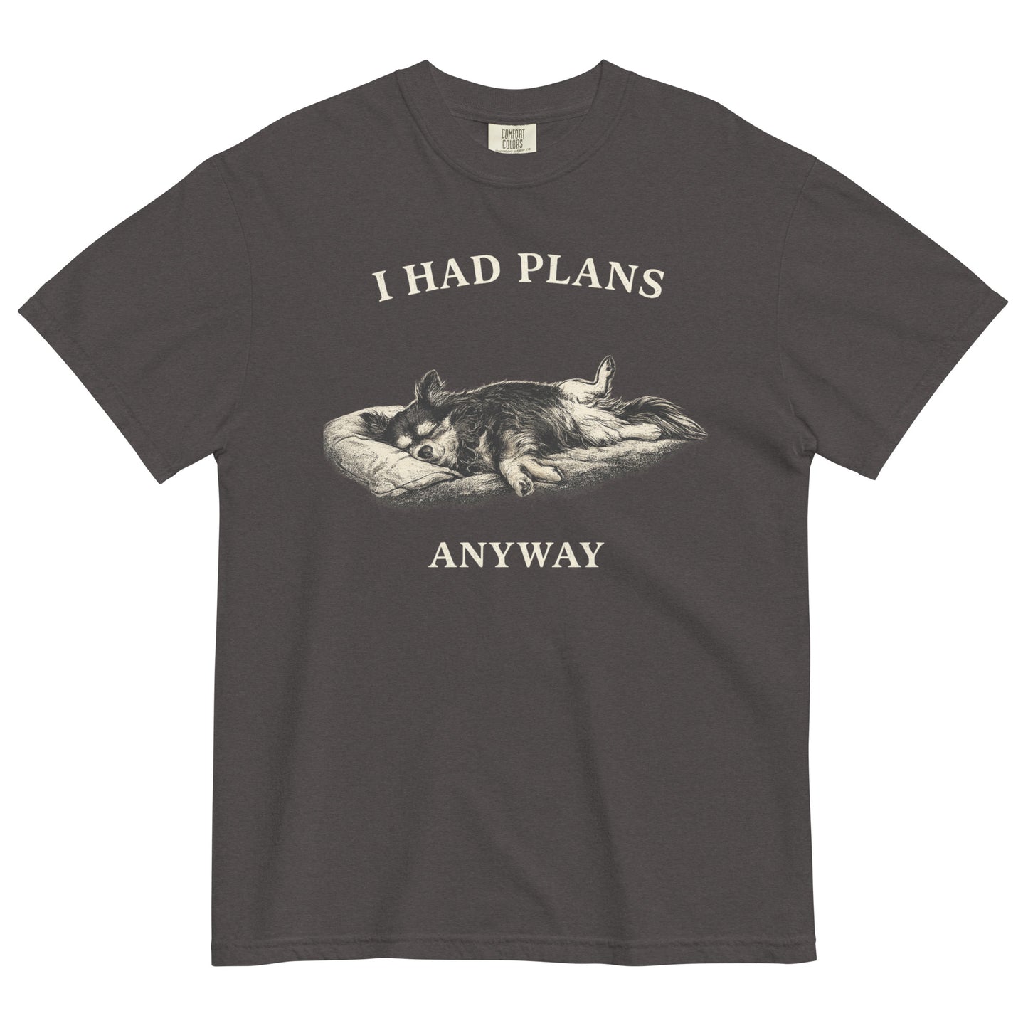 A graphite colored t-shirt featuring a monochrome illustration of a long-haired Chihuahua sleeping deeply on its back in a dog bed, with rear legs splayed open and forepaws crossed. Above the illustration in bold, white capital letters is the text 'I HAD PLANS', and below it reads 'ANYWAY'.