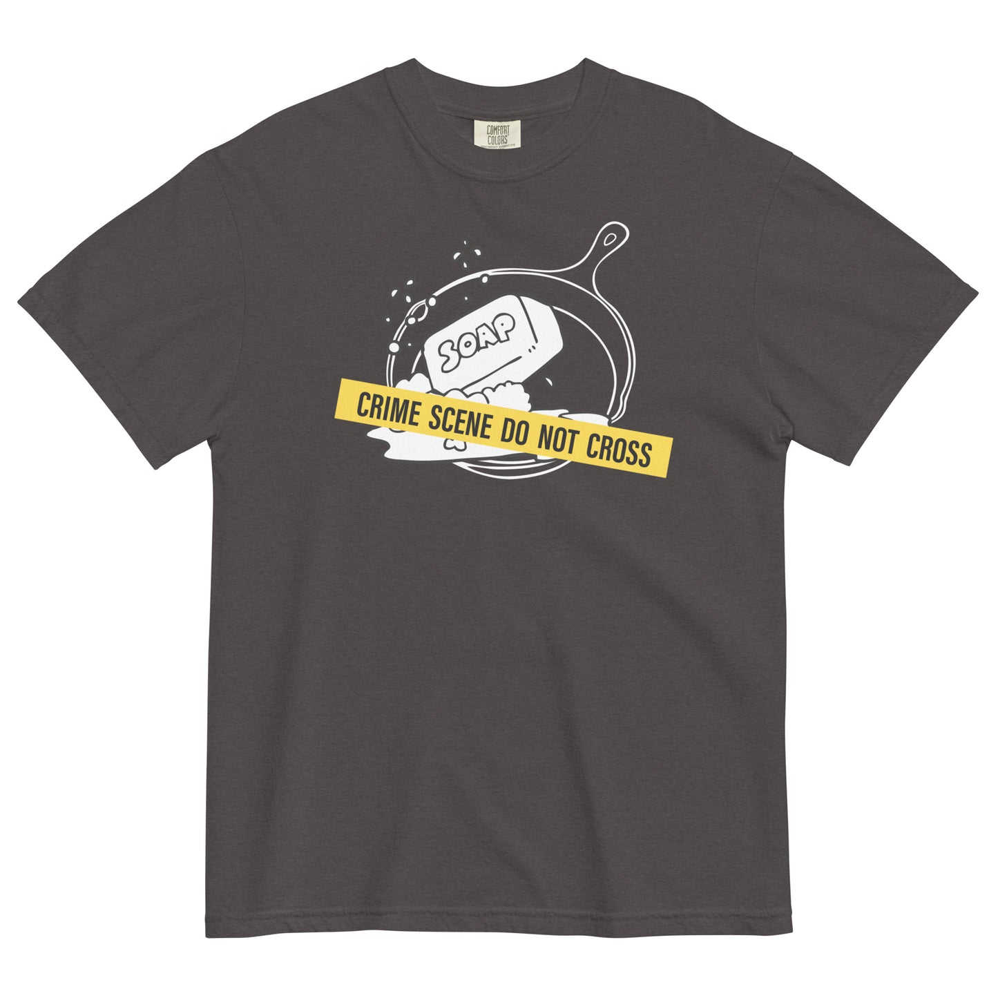 A graphite colored t-shirt with a graphic of a cast iron pan with a bar of soap in it, crossed with crime scene tape that reads 'Crime Scene Do Not Cross'.