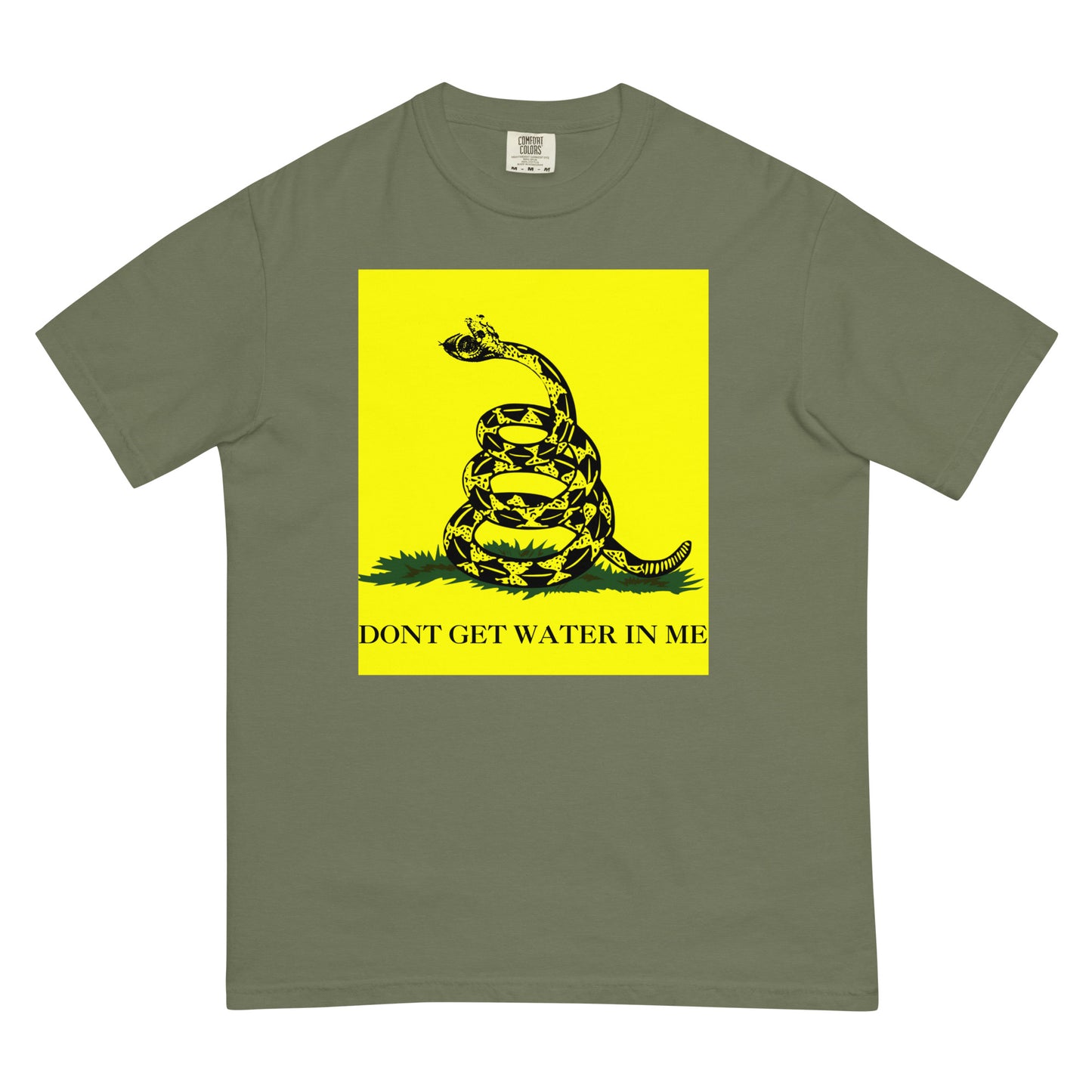 A moss green colored t-shirt with a yellow Gadsden Flag style graphic featuring a snake on a bed of grass. Under the bed of grass is the all-caps text, 'DON'T GET WATER IN ME'. The snakes jaws are open to reveal a watch face. 