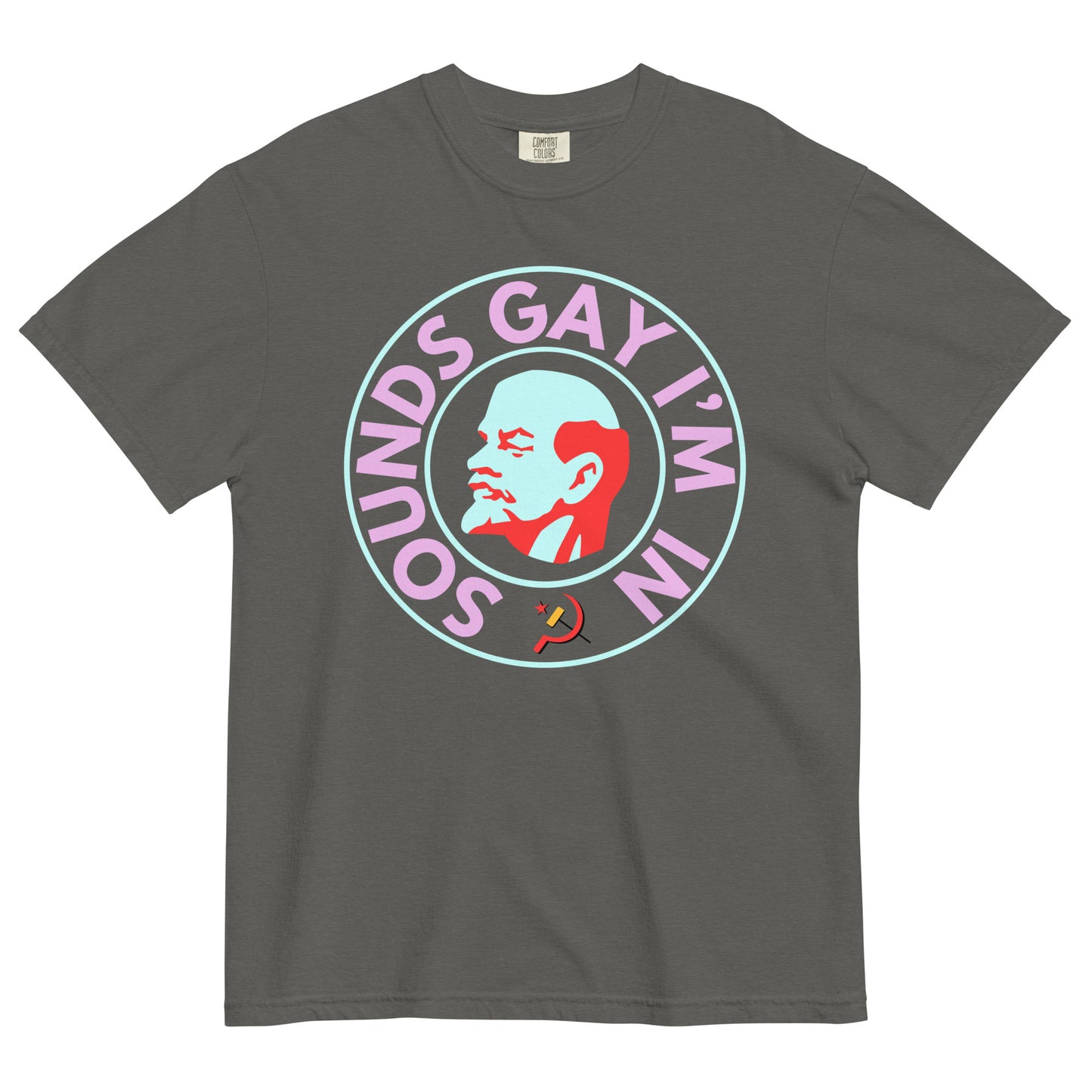 A pepper colored crew neck t-shirt on a white background. The chest shows a graphic of an art deco style bust of Lenin's right profile with a light blue face and red hair, beard and eyebrows surrounded by a line circle in the same light blue. An outer circle of bold all caps neon pink text reads, 'SOUNDS GAY I'M IN' beginning at the 7 o'clock position. It is surrounded by the same light blue circle. 