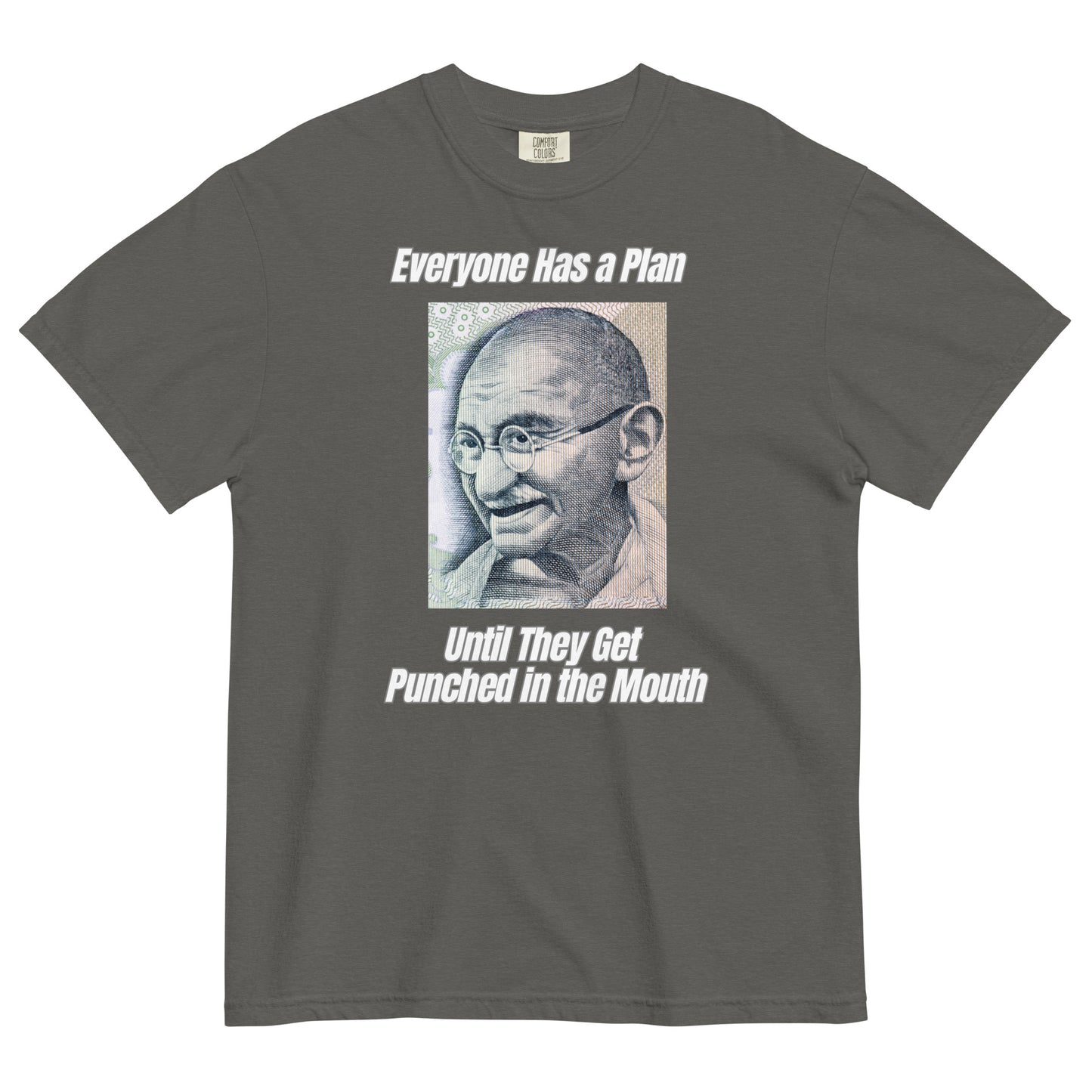 A pepper colored t-shirt featuring a vintage portrait of Mahatma Gandhi ironically paired with the famous quote 'Everyone Has a Plan Until They Get Punched in the Mouth'