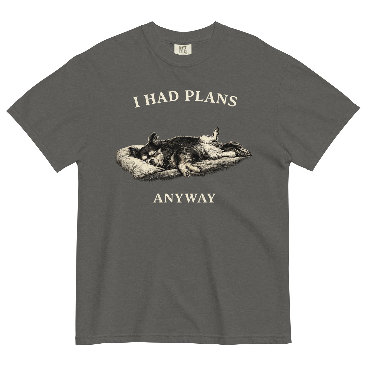 A pepper colored t-shirt featuring a monochrome illustration of a long-haired Chihuahua sleeping deeply on its back in a dog bed, with rear legs splayed open and forepaws crossed. Above the illustration in bold, white capital letters is the text 'I HAD PLANS', and below it reads 'ANYWAY'.