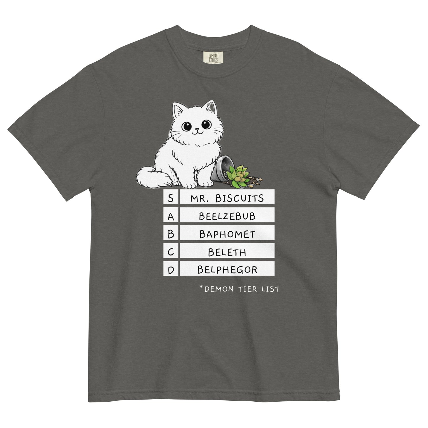 A pepper colored t-shirt with a graphic of a white, fluffy kitten standing behind a knocked over plant. Beneath the cat is a 'Demon Tier List' with the cat 'Mr. Biscuits' listed atop the list in the S tier position.