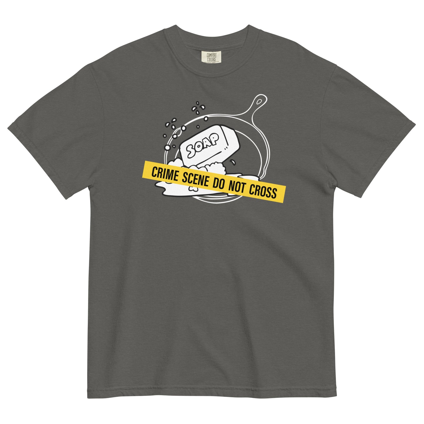 A pepper t-shirt with a graphic of a cast iron pan with a bar of soap in it, crossed with crime scene tape that reads 'Crime Scene Do Not Cross'.