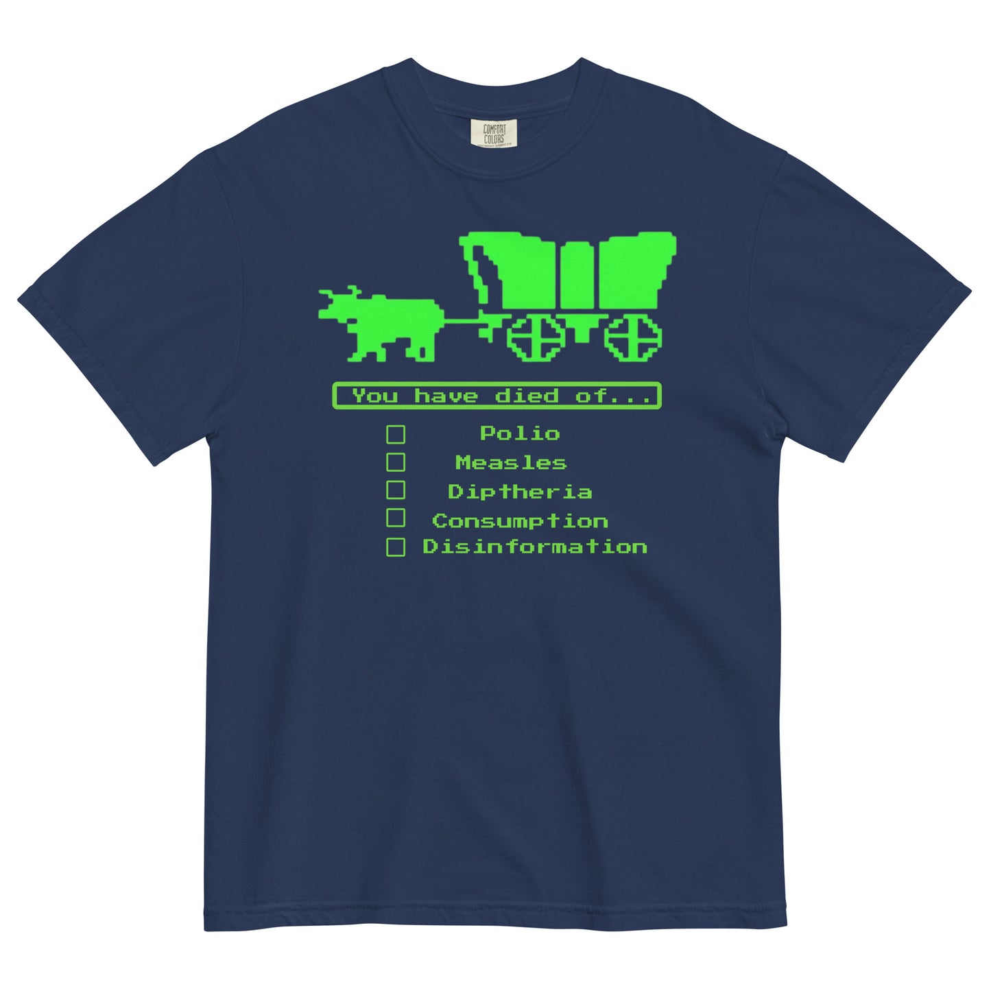 A navy blue short-sleeve crewneck t-shirt featuring a bright green, retro 8-bit pixel graphic. The design shows an ox pulling a covered wagon above a text box that reads 'You have died of...'. Below the text is a checklist with empty square boxes next to the words 'Polio', 'Measles', 'Diptheria', 'Consumption', and 'Disinformation'