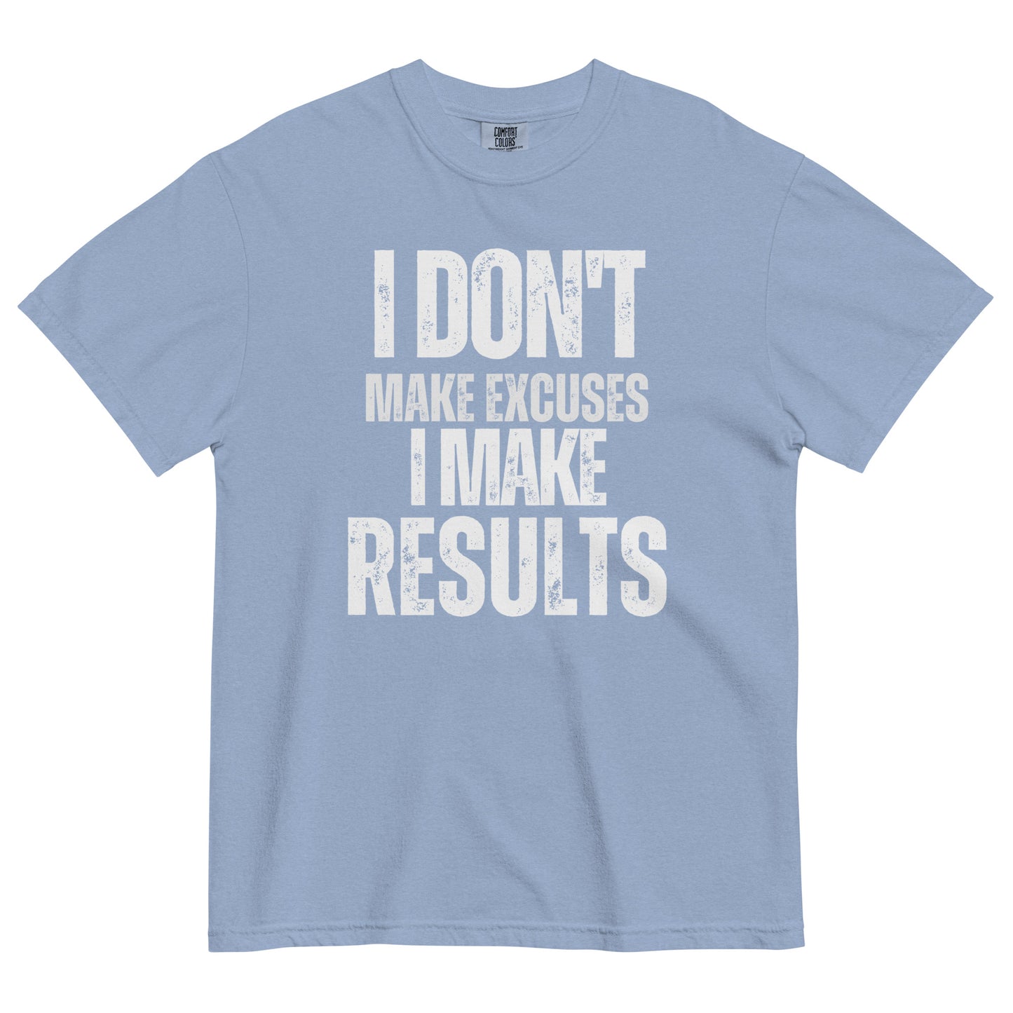 A washed denim colored t-shirt with bold, all-caps, distressed text that reads 'I DON'T MAKE EXCUSES I MAKE RESULTS', on a white background.