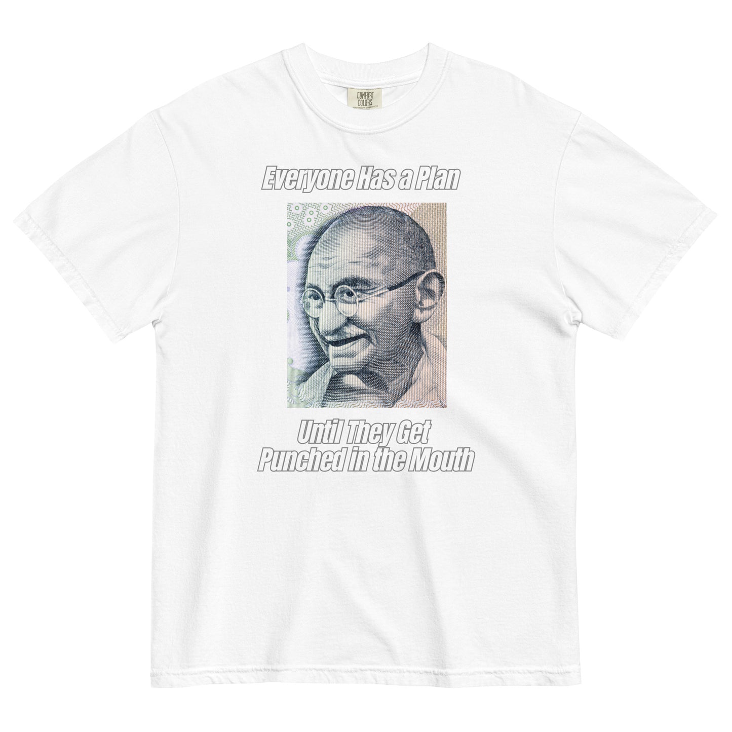 A white colored t-shirt featuring a vintage portrait of Mahatma Gandhi ironically paired with the famous quote 'Everyone Has a Plan Until They Get Punched in the Mouth'